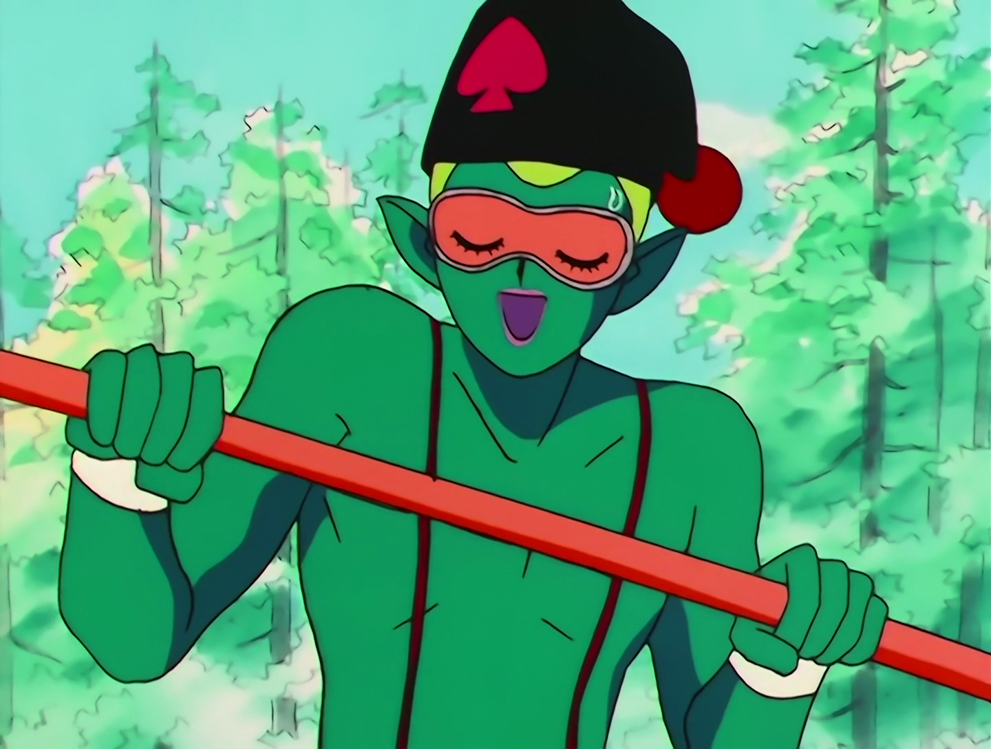 Tsunawatarou in closeup. He’s now holding the pole horizontally and has an orange blindfold decorated with sleeping eyes.